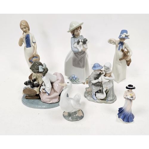 1 - Group of Lladro, Nao, Rex and other porcelain figures similar, including a Lladro group of a girl wi... 