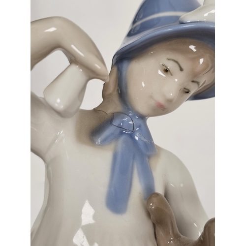 1 - Group of Lladro, Nao, Rex and other porcelain figures similar, including a Lladro group of a girl wi... 