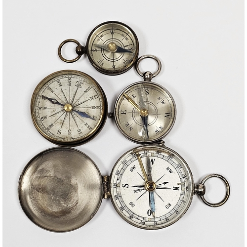 109A - Four late 19th/early 20th century pocket compasses, two in brass cases and two silvered, three with ... 