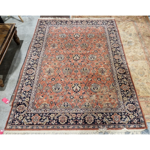 1193 - Large Eastern salmon ground rug with floral field to floral border, 279cm x 198cm