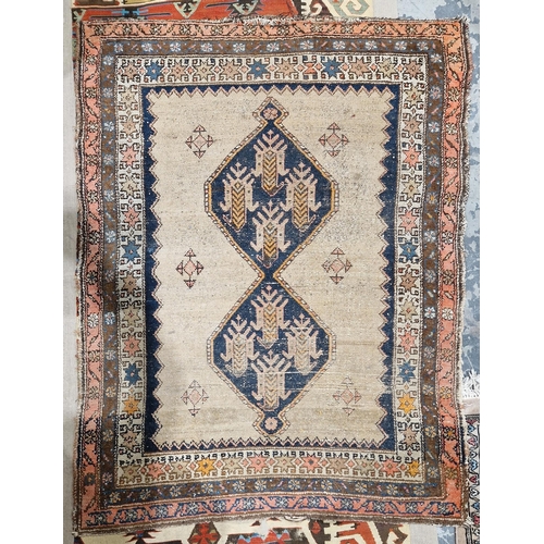 1198 - Eastern mushroom ground rug, central panel with joined lozenges to floral borders, 154cm x 110cm