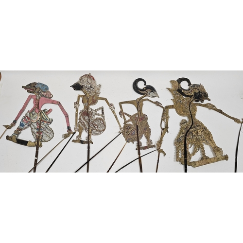 147 - Collection of Indonesian shadow puppets including articulated paper and vellum examples with intrica... 