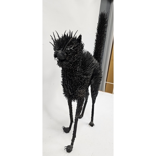 158 - Black metal model of a standing cat with spiky upright fur, 72cm high