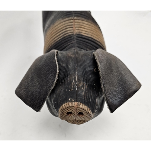 160 - Articulated wooden model of a pig, probably by Jeff Soan, with brown leather ears and rope tail, mod... 