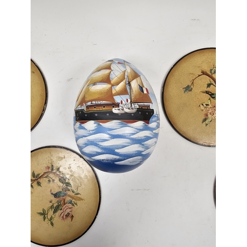 173 - Painted wooden egg decorated with a view of a sailing ship, titled 'The Robuchon' to base and a set ... 