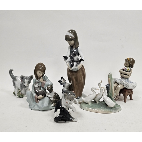 4 - Group of Lladro and Nao figures and models of animals, including a Lladro figure of a girl seated wi... 