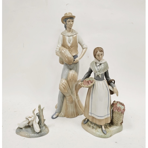 56 - Large Miquel Requena (Valencia) porcelain figure of a farmer standing before wheat sheaves, a figure... 