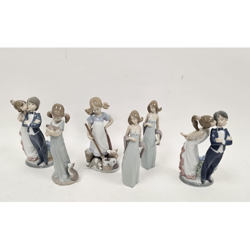 7 - Six boxed Lladro figures, printed marks, including a figure of a young girl holding a kitten, a mode... 