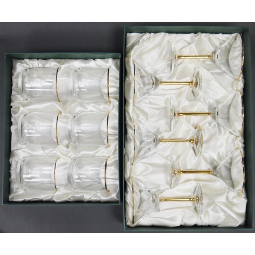 76 - Guild glassware gold rimmed part table service, boxed, including wine glasses in sizes, tumblers, ch... 