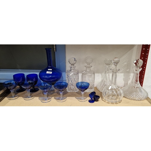 114 - Collection of blue tinted and cut glassware, including: a blue ewer on lobed spirally moulded stem a... 