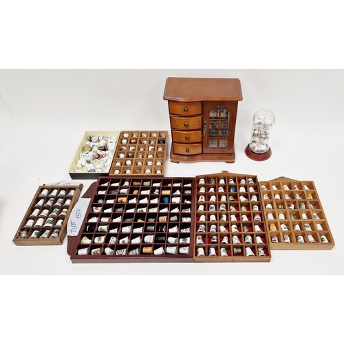 121A - A collection of ceramic thimbles  within various fitted display cases, a wood jewellery box, formed ... 