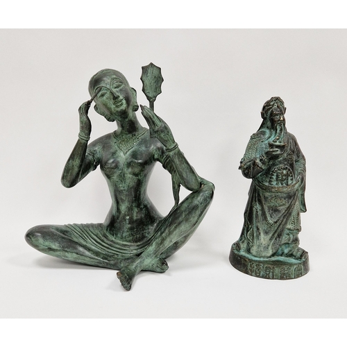 151 - Patinated metal figure of an Eastern girl sitting cross-legged, holding up a mirror while she does h... 