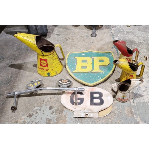 164 - Collection of vintage motoring items to include a metal BP sign painted green and yellow, a Shell X1... 