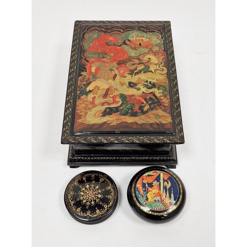 183 - Group of painted Russian lacquer boxes comprising a hinged rectangular example decorated with a batt... 