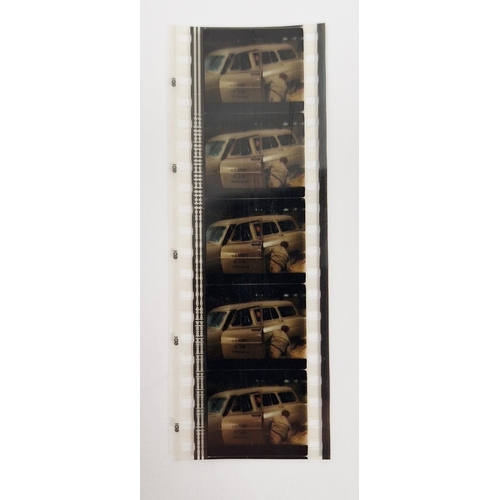 195 - James Bond - a 35mm film cell strip, with five frames from Goldfinger (1964), by repute given to the... 