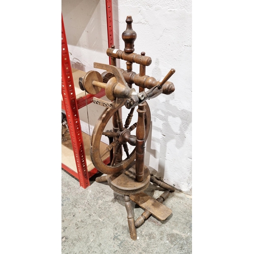 227 - 20th century spinning wheel, probably beech, on baluster tripod supports, 87.5cm high