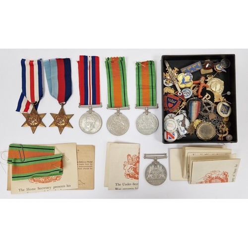 243 - Collection of military medals and badges including three WWII Defence medals, a George VI Star, a Fr... 