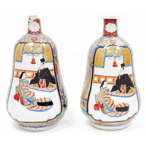 262 - Pair of Japanese Meiji period (1868-1912) gourd-shaped imari vases, each painted with figures in dis... 