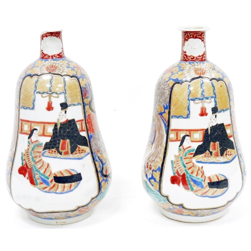 262 - Pair of Japanese Meiji period (1868-1912) gourd-shaped imari vases, each painted with figures in dis... 