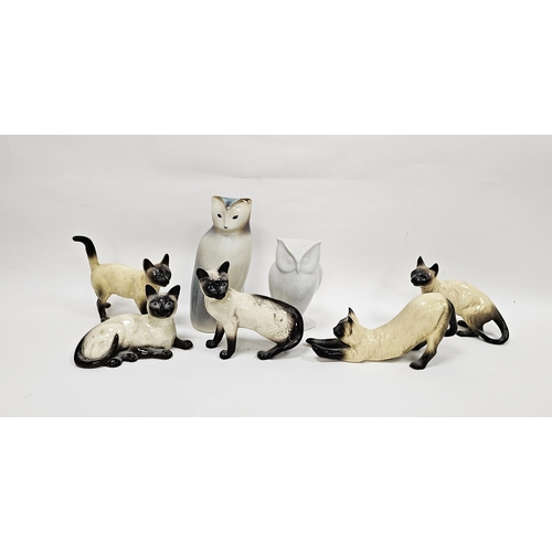 39 - Two Beswick pottery models of Siamese cats and three similar, printed black marks and impressed shap... 