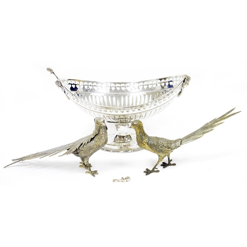 412 - Large silver plated boat-shaped pedestal bowl, pierced border and mask handles, approximately 25.5cm... 