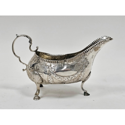 441 - George III Irish silver sauceboat by Matthew West, Dublin (no date letter), decorated with garlands,... 