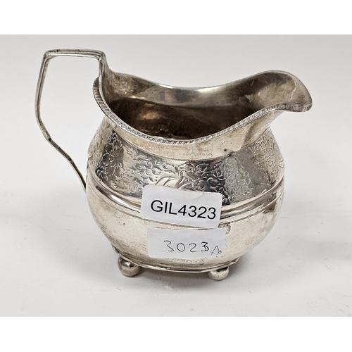 447 - George III silver cream jug, marks rubbed, of shaped oval form engraved with a band of flowers, on f... 