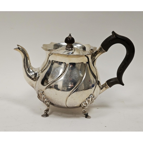 457 - Edwardian silver bachelor's teapot by Carrington & Co, London 1907, of circular form on four leaf ca... 