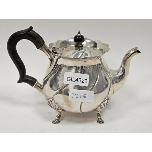 457 - Edwardian silver bachelor's teapot by Carrington & Co, London 1907, of circular form on four leaf ca... 