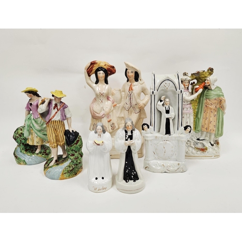 46 - Collection of Staffordshire pottery figures including a Wesley clock face group and two further figu... 