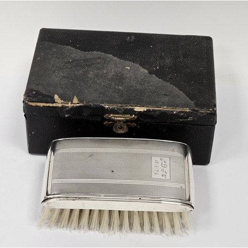 485 - Elizabeth II silver backed engine turned clothes brush, in leather box, engraved with initials and t... 