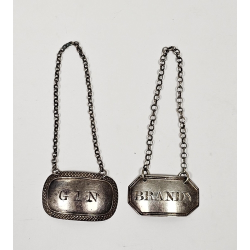 490 - Two Georgian silver wine labels, one by Joseph Willmore, Birmingham 1820, of oval form engraved 'Gin... 