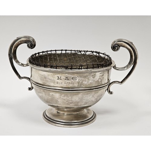 509 - Silver two-handled rose bowl, circular with free scroll handles, double moulding to the body, on cir... 