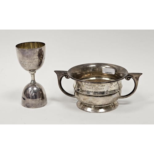 519 - Silver two-handled bowl, Birmingham 1924, of circular waisted form with two stylised scroll handles,... 