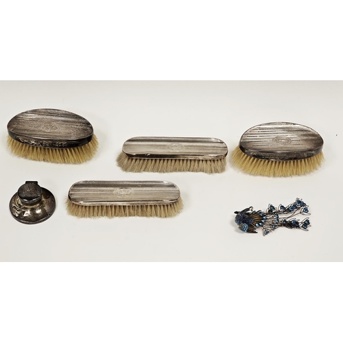 521 - Silver-backed dressing table brush set comprising two pairs of brushes, monogrammed and with engine-... 