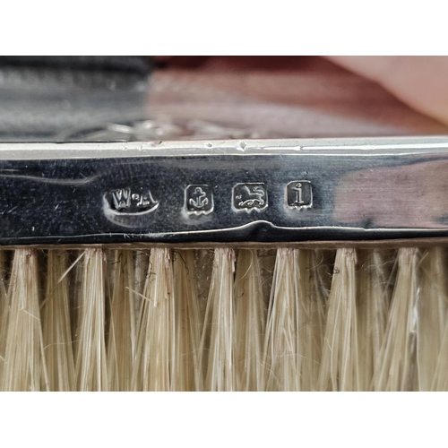 521 - Silver-backed dressing table brush set comprising two pairs of brushes, monogrammed and with engine-... 