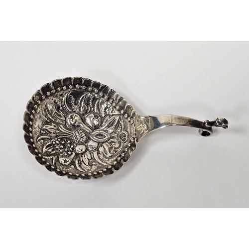 541 - 19th century silver caddy spoon, hammered and embossed bowl depicting various fruits including a pin... 