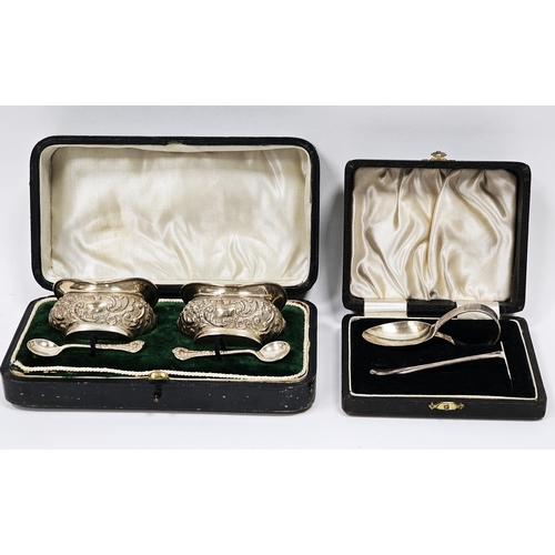 556 - Pair of Edwardian silver salts, Birmingham 1904, of shaped oval design with floral and scroll decora... 