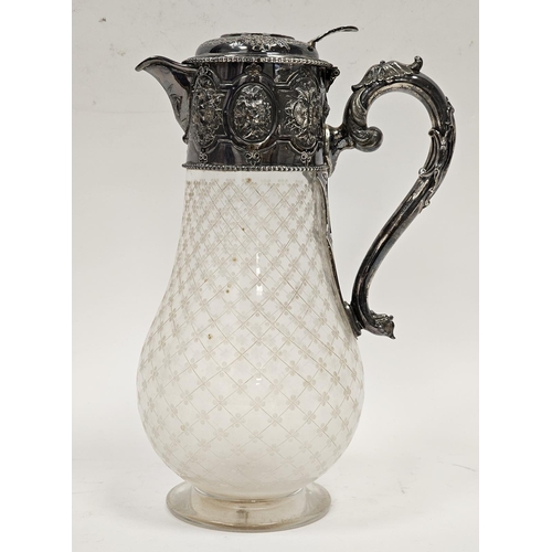 587 - A mid Victorian silver and cut glass claret jug, the circular hinged cover engraved with family cres... 