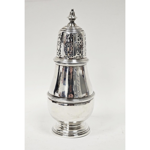 613 - A George VI silver baluster shape sugar caster, the pierced detachable cover with knop finial, the w... 