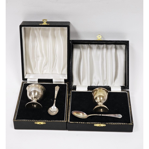 619 - A silver egg cup and spoon christening set, Birmingham 1968; together with another egg cup, Birmingh... 