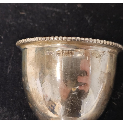 619 - A silver egg cup and spoon christening set, Birmingham 1968; together with another egg cup, Birmingh... 