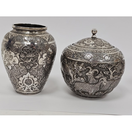 640 - Pair of Persian/Iranian white metal vases of baluster form, densley decorated with shaped cartouches... 