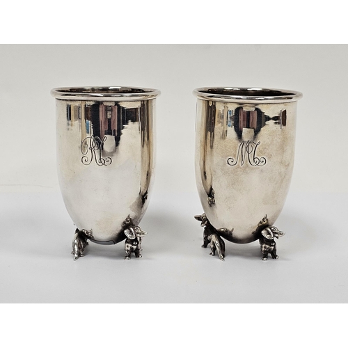 646 - Pair Italian silver-coloured metal goblets, circular and tapering on two dachshund supports, initial... 