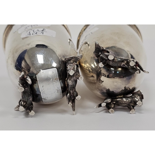 646 - Pair Italian silver-coloured metal goblets, circular and tapering on two dachshund supports, initial... 