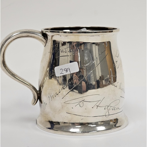 647 - Early 20th century Indian silver-coloured metal presentation mug with slight everted rim, scroll han... 