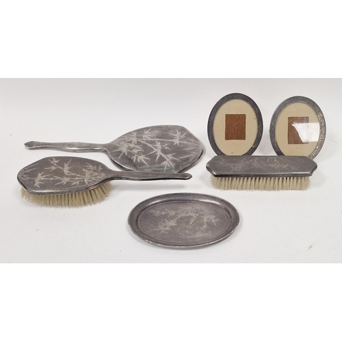 658 - Tackhing Hong Kong sterling four-piece dressing table set to include hand mirror, hair brush, clothe... 