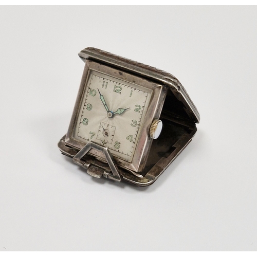 664 - Early 20th century silver-cased folding watch housed in a leather case, the square watch dial having... 