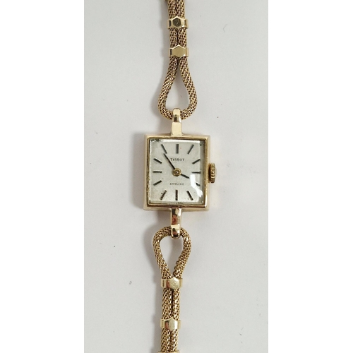 687 - Lady's 9ct gold Tissot wristwatch with square dial, baton numerals and the fancy chain link bracelet... 