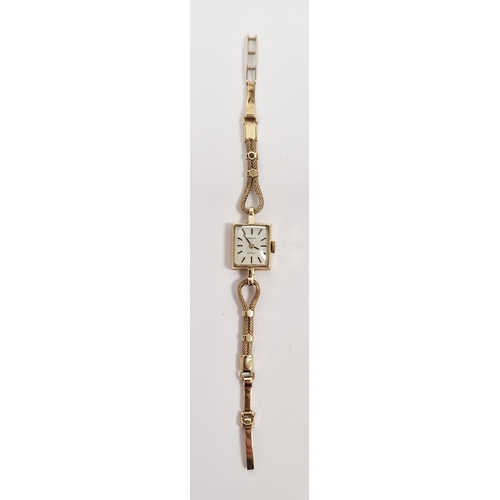 687 - Lady's 9ct gold Tissot wristwatch with square dial, baton numerals and the fancy chain link bracelet... 